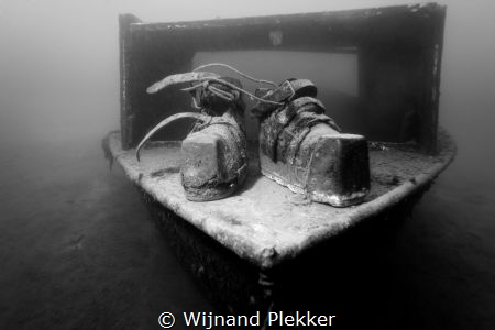 Old school diver shoes on little wreck in Kempervennen La... by Wijnand Plekker 