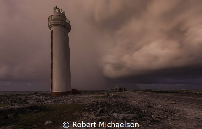 Passing Storm at dawn at dive site Lighthouse Point, Bonaire by Robert Michaelson 