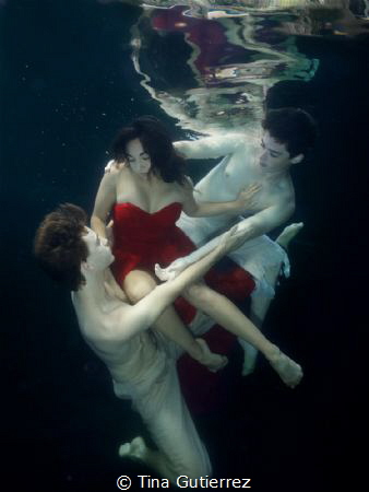 Ship wrecked in Red.  pool with Ballet Dancers by Tina Gutierrez 