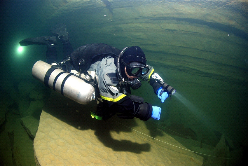 Diver in a cave in france in sidemount config. by Andy Kutsch 