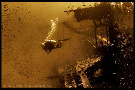 Diver on Sugar wreck in Perhentian islands. by Soren Egeberg 
