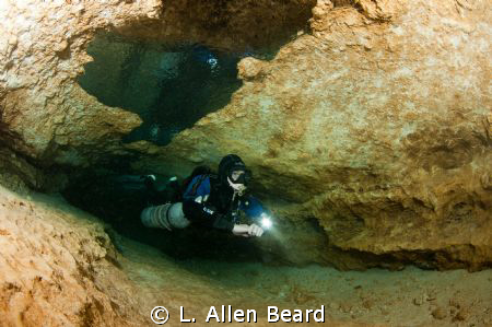 Cave diver in the Peanut Tunnel of Peacock Springs Cave S... by L. Allen Beard 