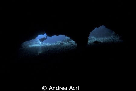 the picturesque cave of gato island by Andrea Acri 