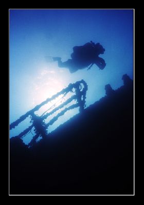 Diver checking out the upper deck of a wreck off the coas... by Johannes Felten 