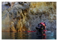 Diver at the surface in the cavern section of a flooded mine. Canon 6D and 15mm lens. Cropped for subject and colour corrected from the RAW file. 