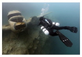 A diver wearing side mount comes face-to-face with the plane in Morrison's Quarry. Photo taken under the ice with a Canon 6D and 15mm lens. Manual exposure. Cropped and colour corrected from the RAW file. 