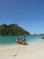 Long tail boat on an island in Phang nga Bay in Thailand 