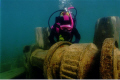 Young diver examines the windlass of the Schooner 'Sweepstakes, Tobermory, Ontario 