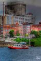 The Coast Guard surveys a Dragon Boat Race on the Cumberland River which travels through downtown Nashville TN. 