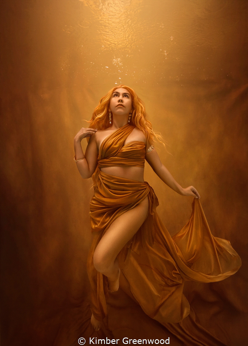 Self Portrait- Making my own Sunshine
Woman in gold against a golden backdrop, despite the rain at the surface of the water. 