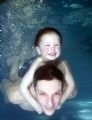 diving piggy back - baby swimming club learning to dive with dad. Canon 10d with strobes. Trying to get the 