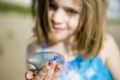 Child Holding Man-Of-War Kite