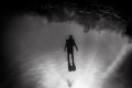 Leaving Hilma Hooker wreck in Bonaire, caught friend's son cruising the reef.  His body language speaks the beauty of diving. (removed distracting fellow divers from frame)