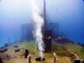 Bubbles from diver penetrating the wreck 