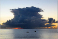 Cumulonimbus.
Sunset.
Fishing boats in the distance.