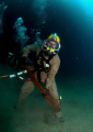 US Navy diver with a small wrench.