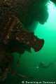 Diver swimming near the wreck of the Keystorm laying on 120 feet of water in the St-Laurence River.