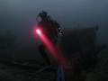 diving the wreck of the Thistlegorm. Diver with torch.