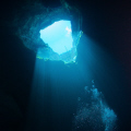 Looking back up into the entrance of Kilsby's Sinkhole at Mt Gambier South Australia.  Depth where photo was taken was about 30m.  The water is crystal clear. Canon 20D Tonika 10-17