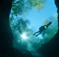 Cave diver riding scooter over Devil's Eye, Ginnie Springs, Gilchrist County, Florida.