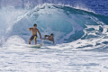 A crowded wave at Pipeline, North Shore, Oahu.