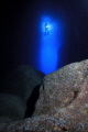 Diver in the entrance of a cave