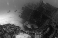 I shot this haunting photo of M/V Capt. Keith Tibbets wreck off Cayman Brac. The silent sentry stands guard over the sea as the divers explore its hull. Shot with a 12-24mm lens