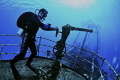 Putting out fires off the bow of the Kitiwake wreck in Grand Cayman..