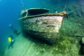 A shot taken at Capernwray Inland Dive Site. The wreck is the ORCA, located in around 8m of water. Shot with a Canon 60D in an Ikelite housing, Lense - Tokina 10-17mm, Strobe - Inon Z240 pointed at the bow of the boat.