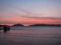 The sun sets off shore at Loloata Resort off the mainland of Papua New Guinea