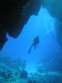 Blue canyon at St Johns. One of the reefs at St Johns had these fissures criss-crossing the reef, providing a wonderful maze of gulleys to explore, leading onto open, sheltered lagoons with hard-coral gardens. My buddy - suitably awe-struck.